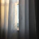 Window blinds adjusting automatically for sunlight